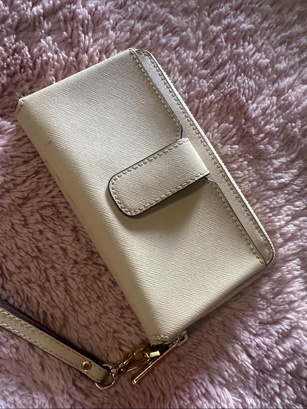 MK wristlet in light tan/ Beige